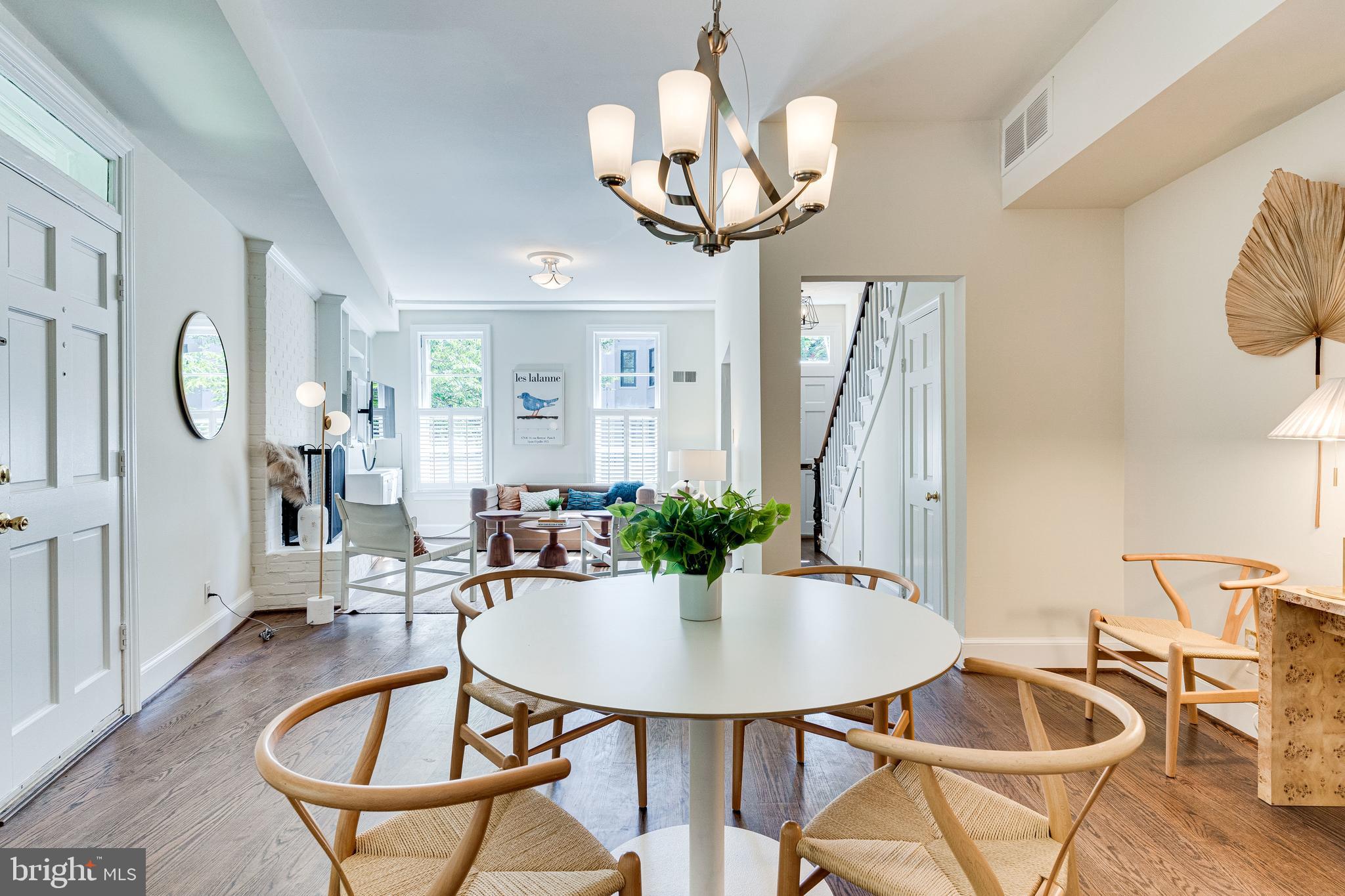 329 11th Street Southeast Washington, DC 20003 - Photo 10 of 49 a view of a dining room with furniture a chandelier and wooden floor