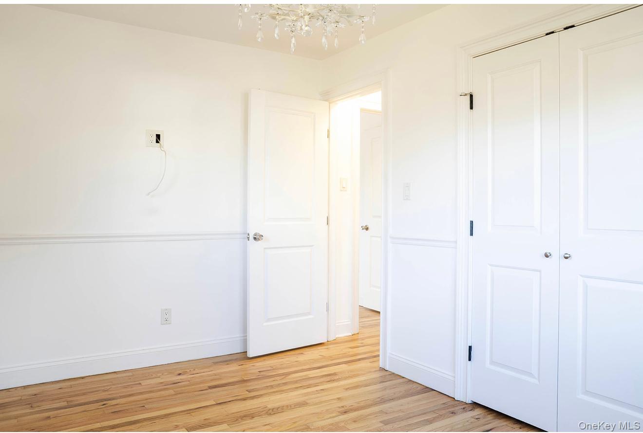 58 Hauppauge Road Hauppauge, NY 11788 - Photo 15 of 34 Unfurnished bedroom featuring a closet and light wood-type flooring