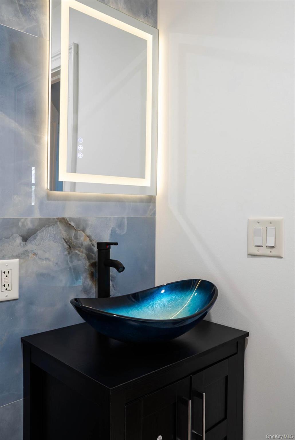 58 Hauppauge Road Hauppauge, NY 11788 - Photo 19 of 34 Bathroom featuring vanity and backsplash