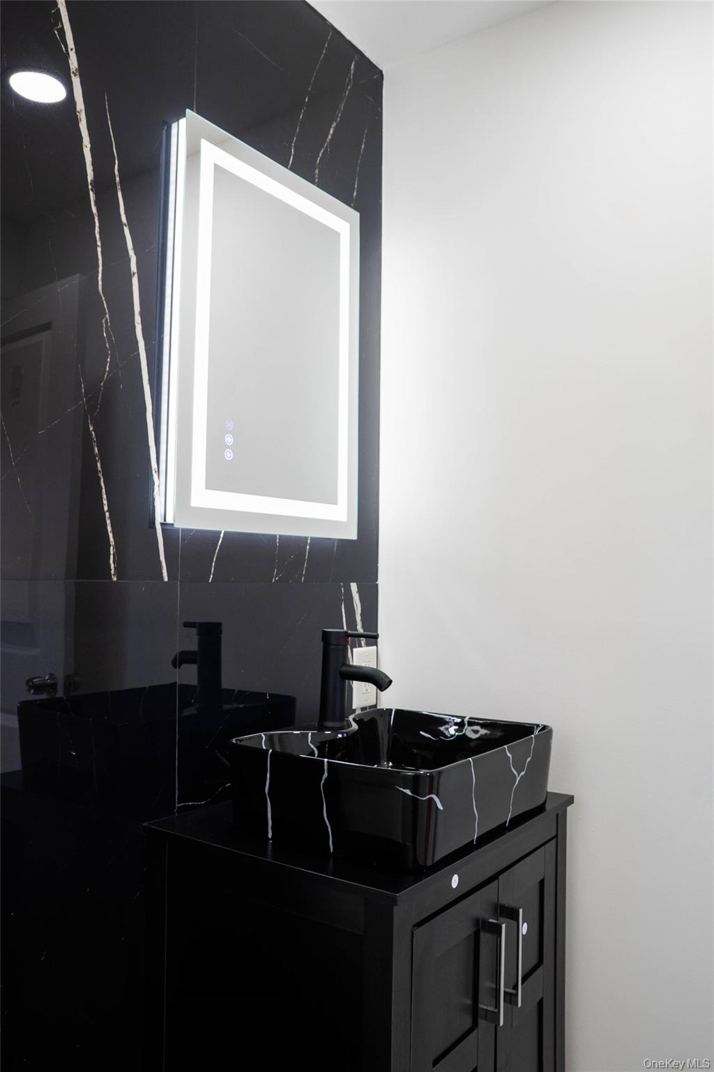 58 Hauppauge Road Hauppauge, NY 11788 - Photo 21 of 34 Bathroom featuring vanity and a marble finish shower