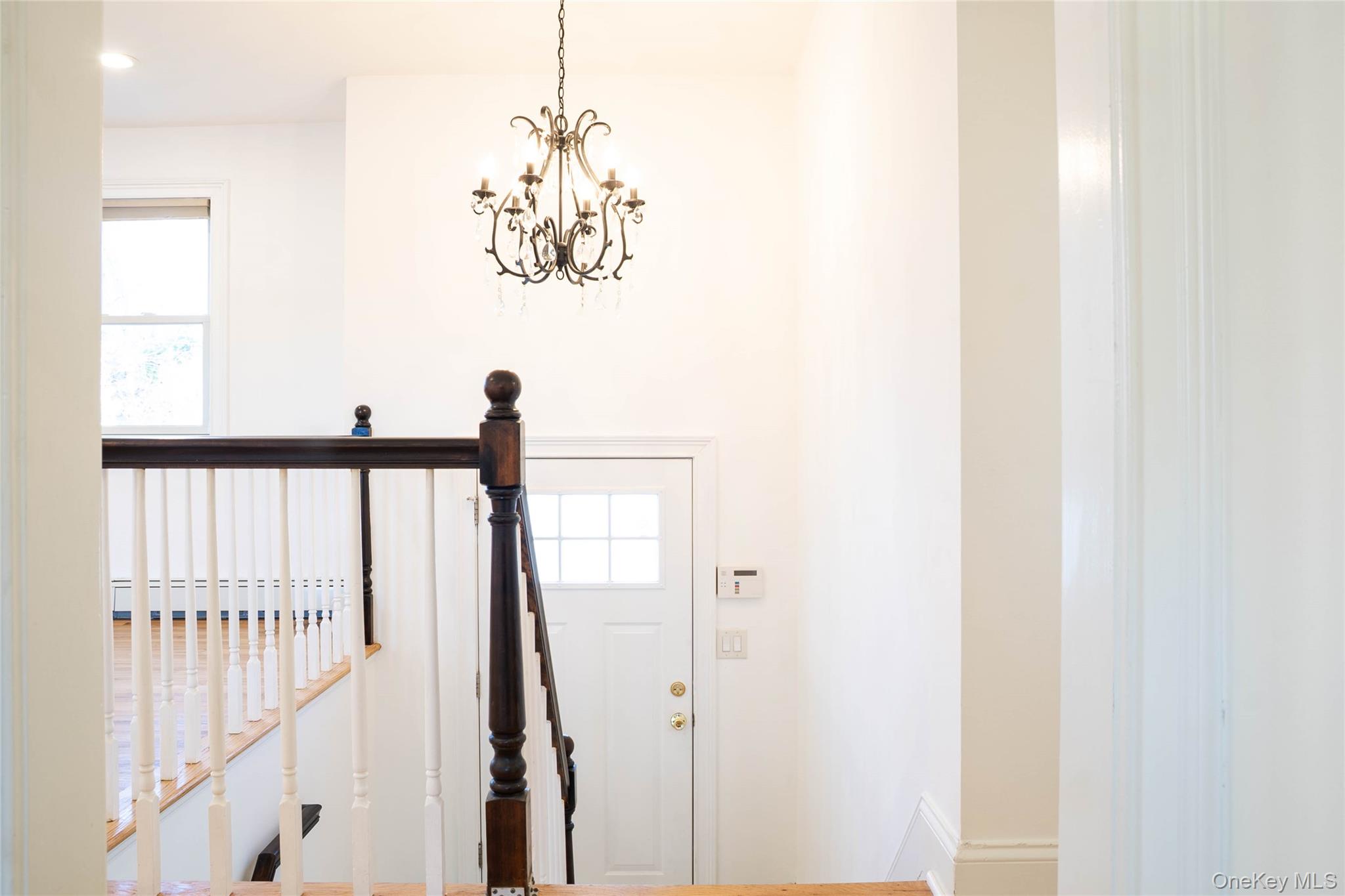 58 Hauppauge Road Hauppauge, NY 11788 - Photo 22 of 34 Entryway featuring plenty of natural light and a chandelier