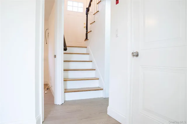 a view of staircase with white walls