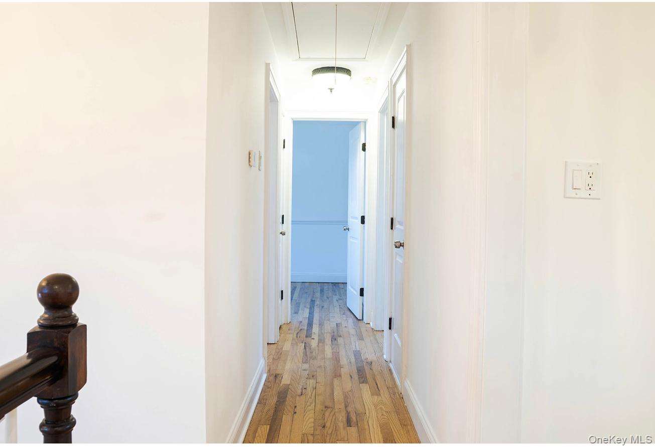 58 Hauppauge Road Hauppauge, NY 11788 - Photo 34 of 34 Hallway with attic access and light wood-style floors