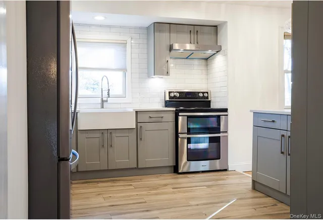 a kitchen with a stove and a microwave