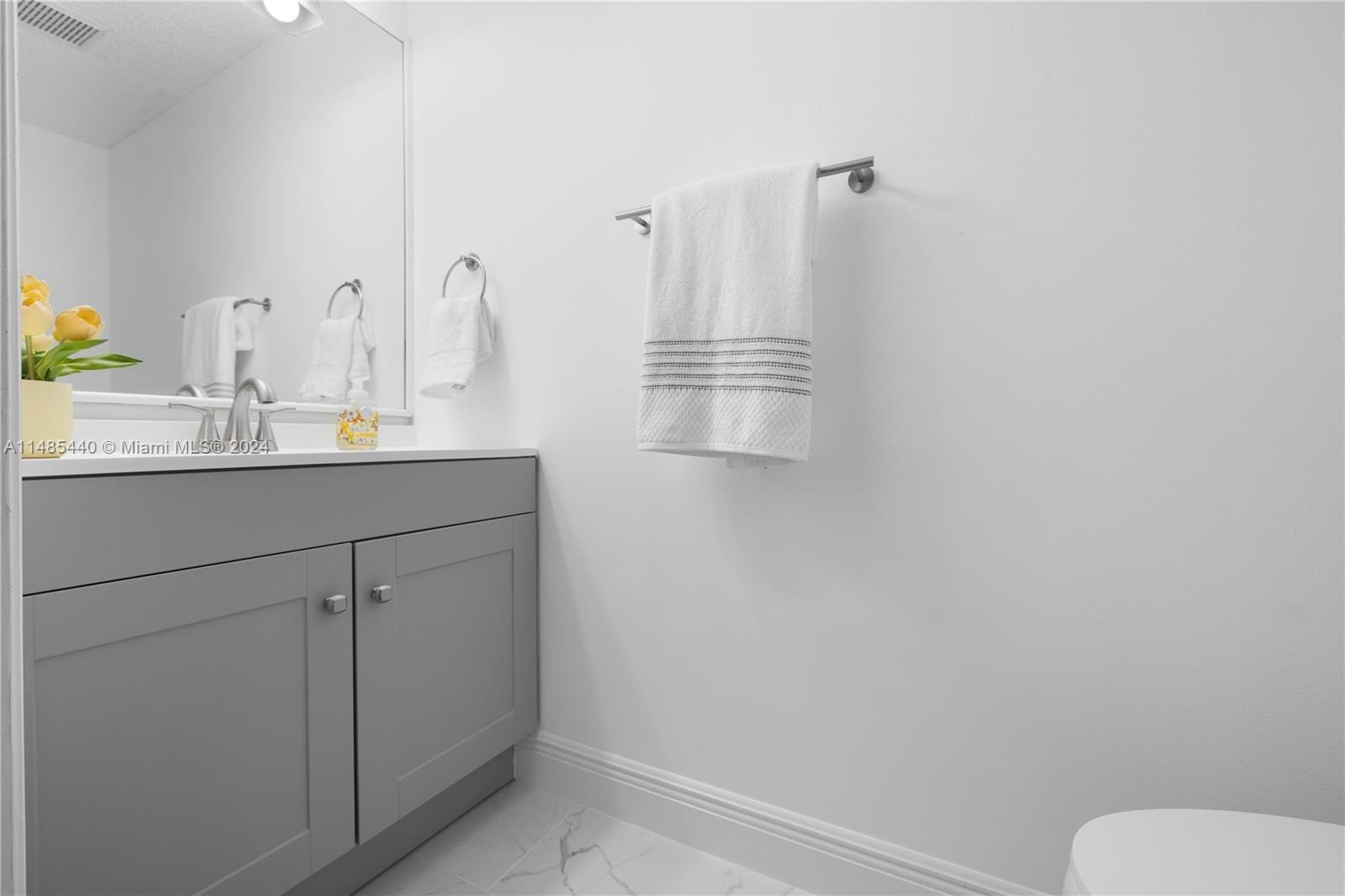 16225 Emerald Cove Road, Unit 16225 Weston, FL 33331 - Photo 12 of 26 a bathroom with a sink and mirror