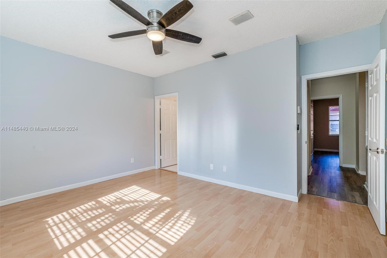 16225 Emerald Cove Road, Unit 16225 Weston, FL 33331 - Photo 13 of 26 a view of an empty room and wooden floor