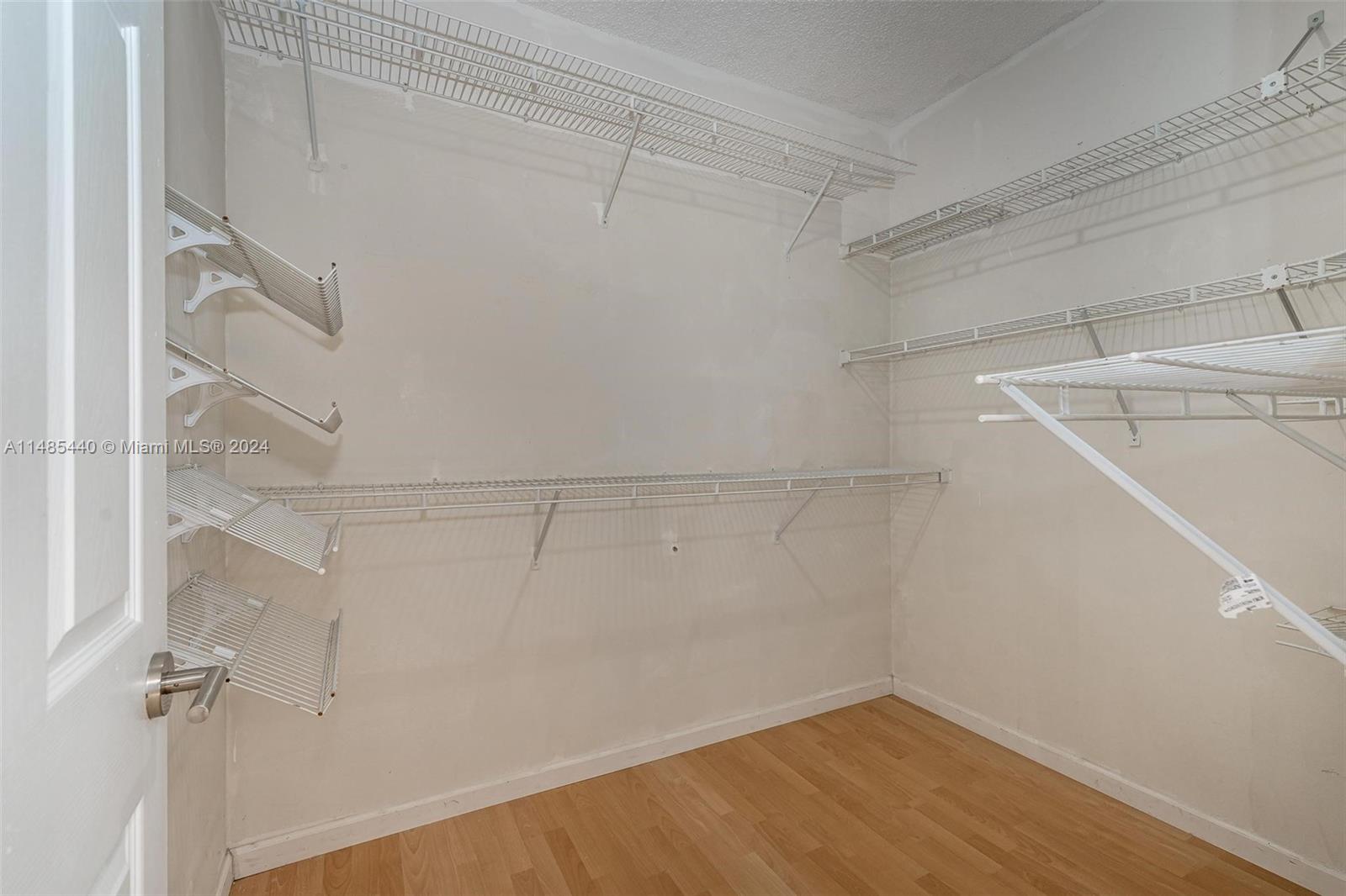 16225 Emerald Cove Road, Unit 16225 Weston, FL 33331 - Photo 17 of 26 a view of a room with racks on the wall