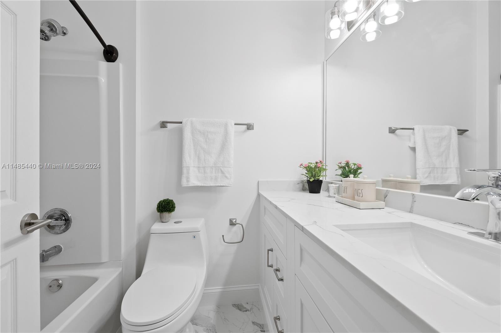 16225 Emerald Cove Road, Unit 16225 Weston, FL 33331 - Photo 20 of 26 a bathroom with a sink a toilet and shower