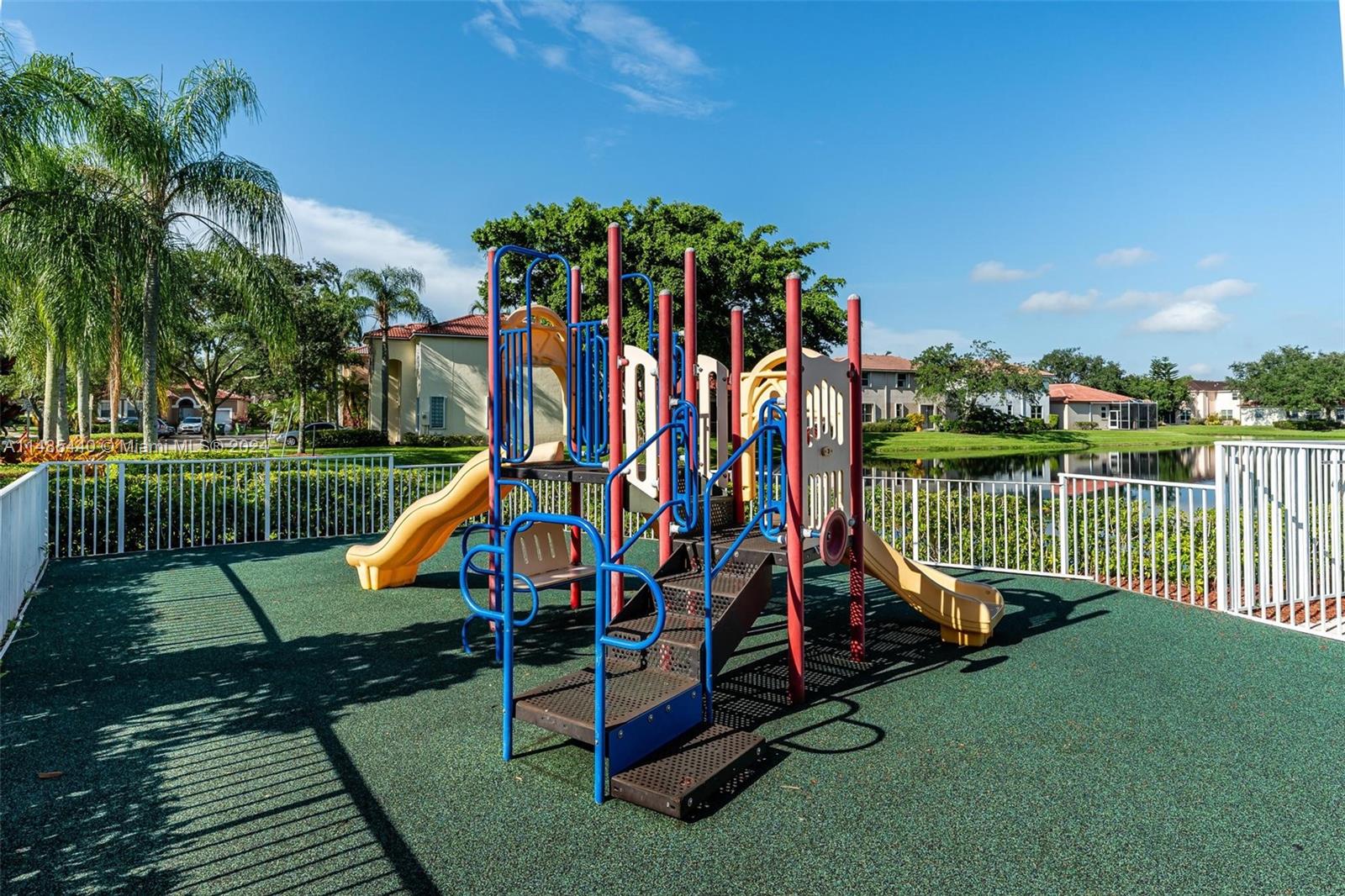 16225 Emerald Cove Road, Unit 16225 Weston, FL 33331 - Photo 23 of 26 a view of a park with slide and a bench