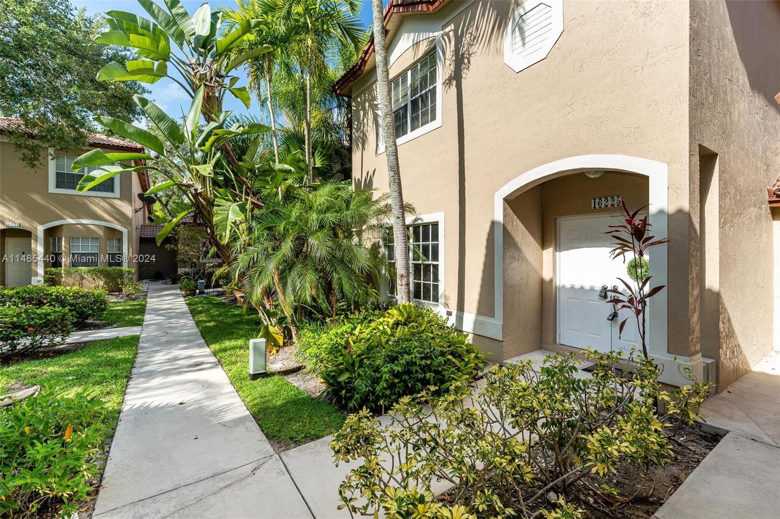 16225 Emerald Cove Road, Unit 16225 Weston, FL 33331 - Photo 25 of 26 a front view of a house having yard