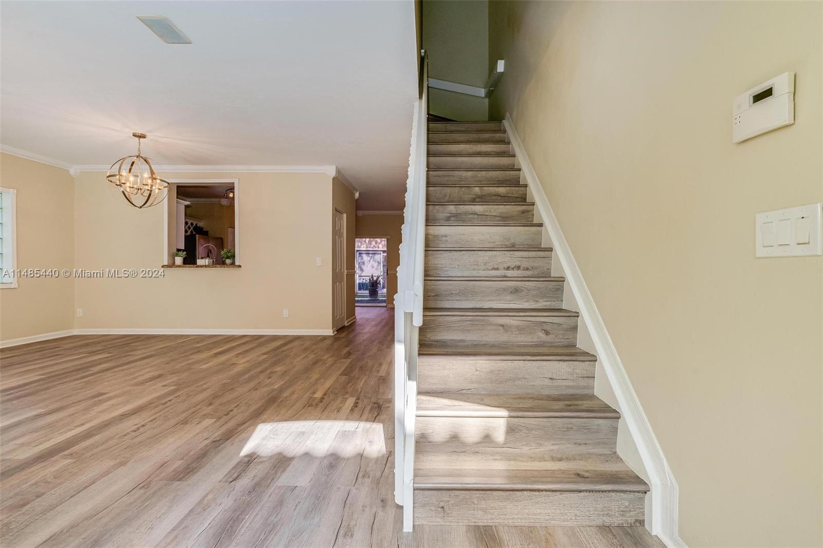 16225 Emerald Cove Road, Unit 16225 Weston, FL 33331 - Photo 4 of 26 a view of entryway and hall with wooden floor