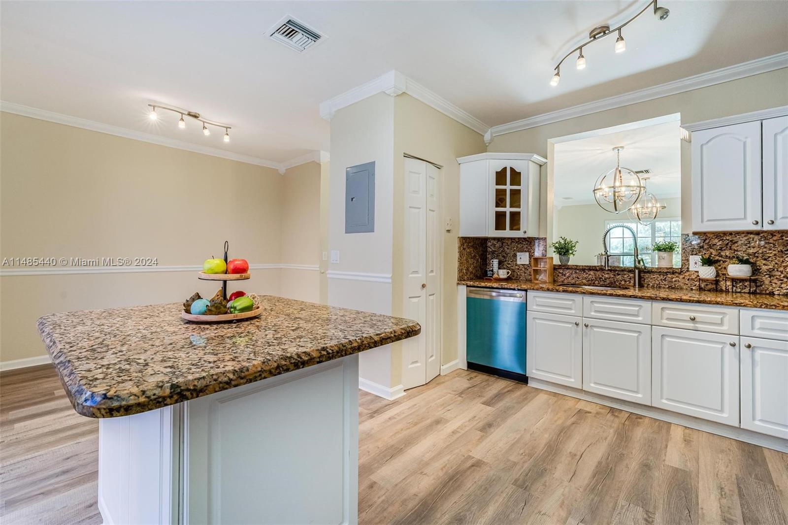 16225 Emerald Cove Road, Unit 16225 Weston, FL 33331 - Photo 7 of 26 a kitchen with stainless steel appliances granite countertop a sink stove and cabinets