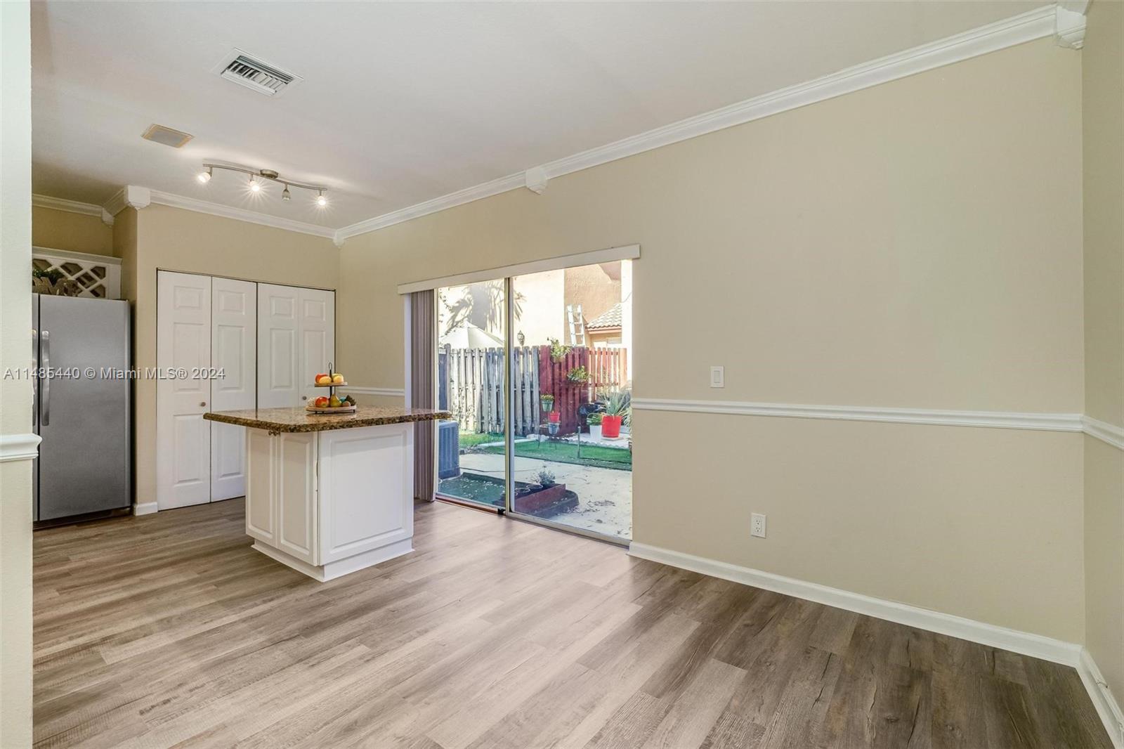 16225 Emerald Cove Road, Unit 16225 Weston, FL 33331 - Photo 9 of 26 a kitchen with a refrigerator and window