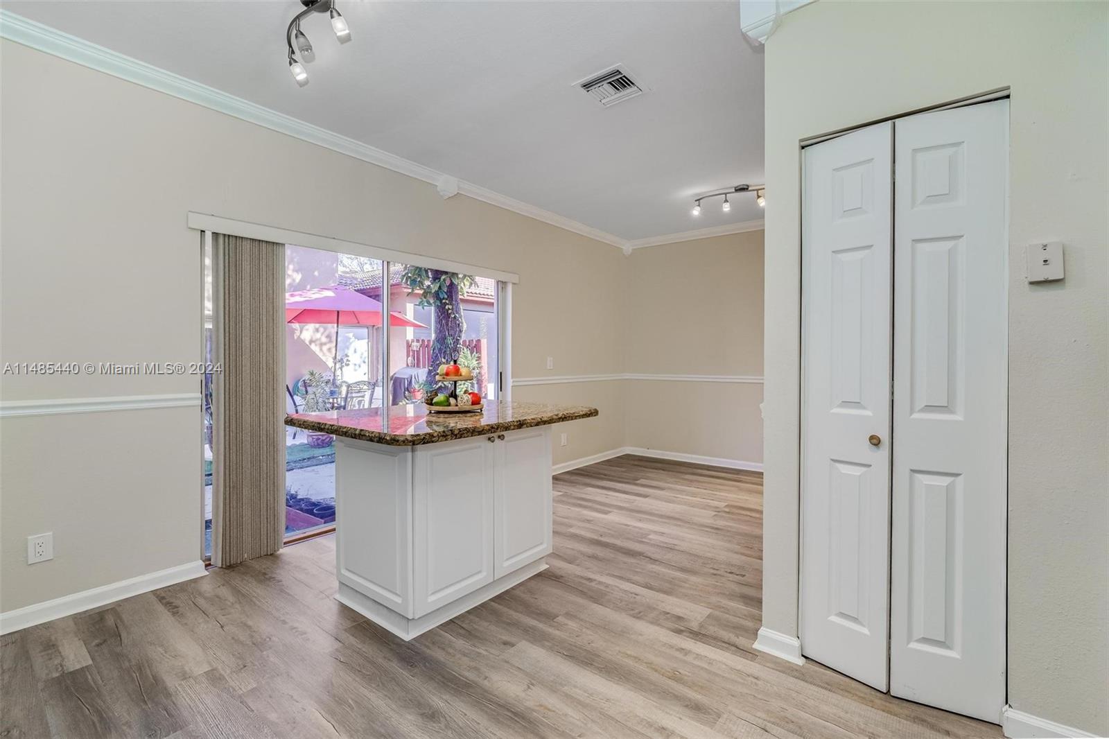 16225 Emerald Cove Road, Unit 16225 Weston, FL 33331 - Photo 10 of 26 a view of a room with wooden floor and cabinet