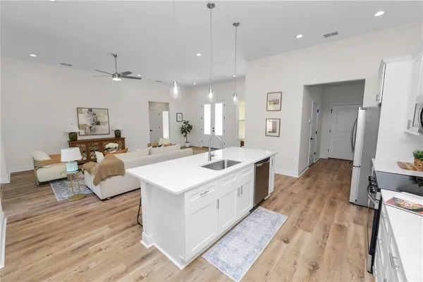 a bed room with a bed and a lamp