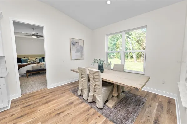 a spacious bedroom with a bed and window