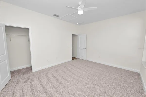 a view of white cabinets and window