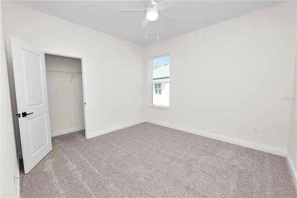 an aerial view of a house with big yard