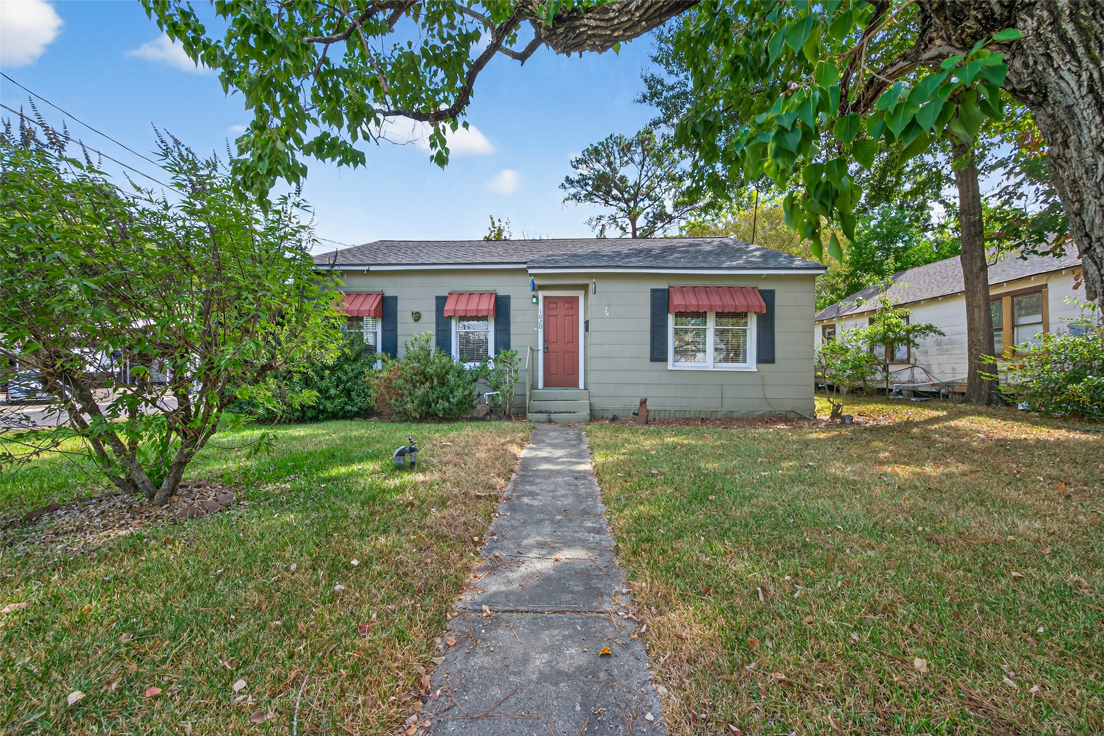 1020 Houston Street Conroe, TX 77301 - Photo 1 of 43 front view of a house with a yard