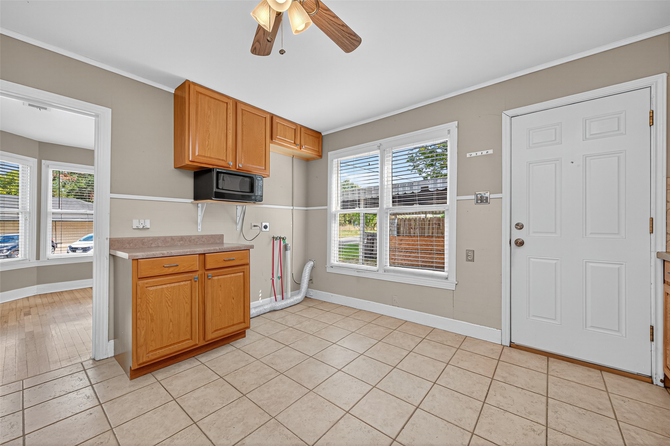 1020 Houston Street Conroe, TX 77301 - Photo 24 of 43 a kitchen with stainless steel appliances granite countertop a stove a sink and a refrigerator