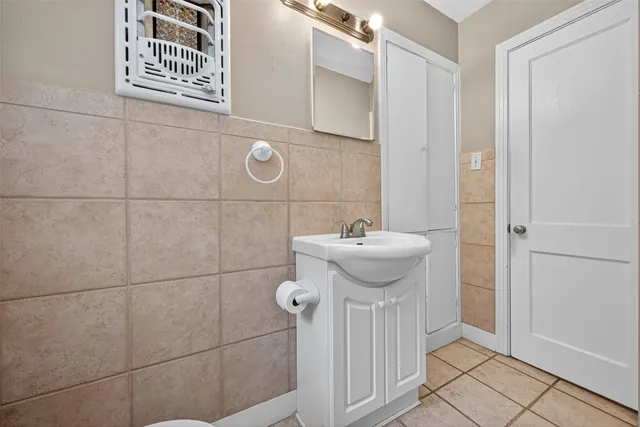 a bathroom with a sink and mirror