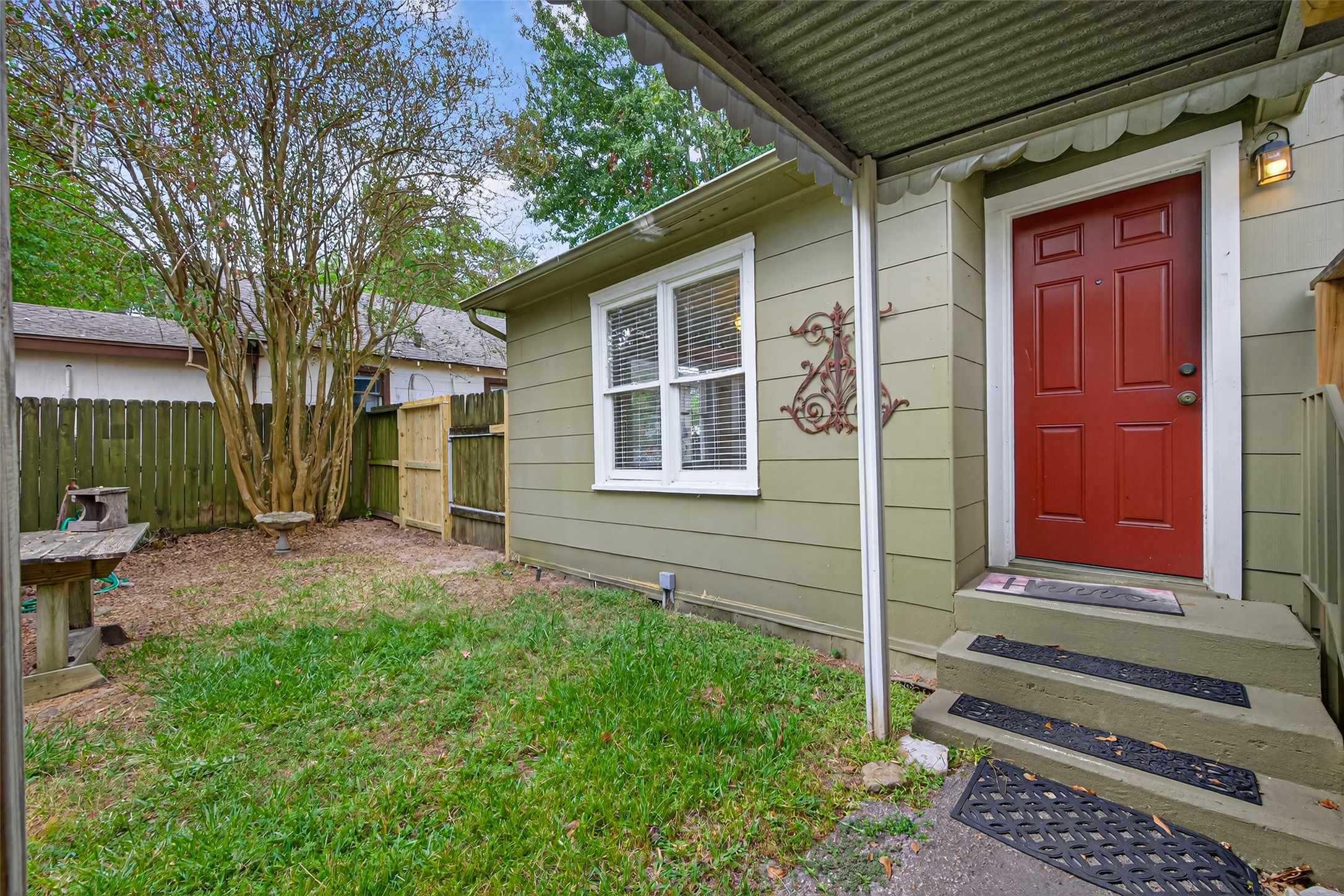 1020 Houston Street Conroe, TX 77301 - Photo 38 of 43 a front view of a house with a garden