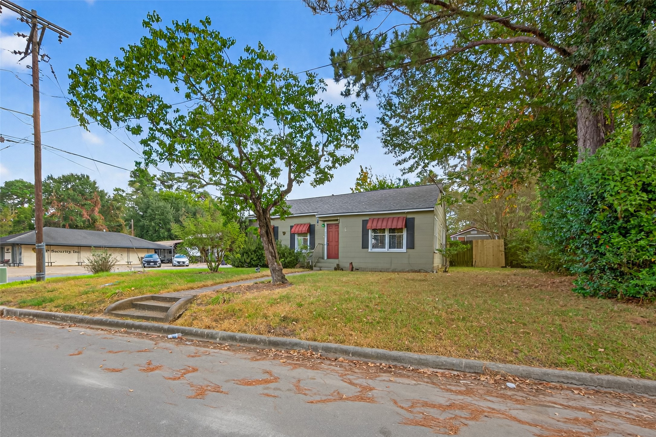 1020 Houston Street Conroe, TX 77301 - Photo 7 of 43 front view of a house with a big yard