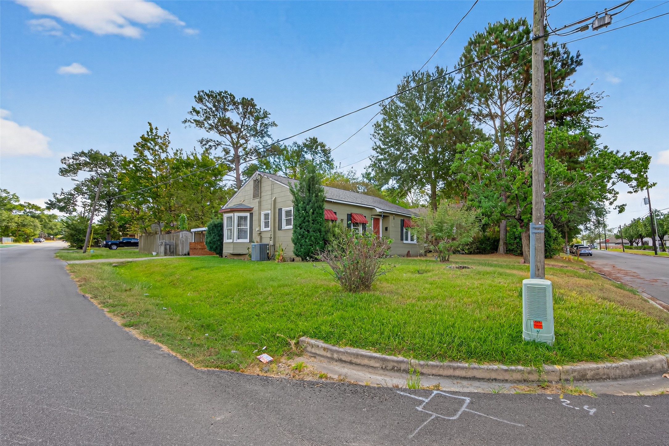 1020 Houston Street Conroe, TX 77301 - Photo 8 of 43 a sign on the side of the road