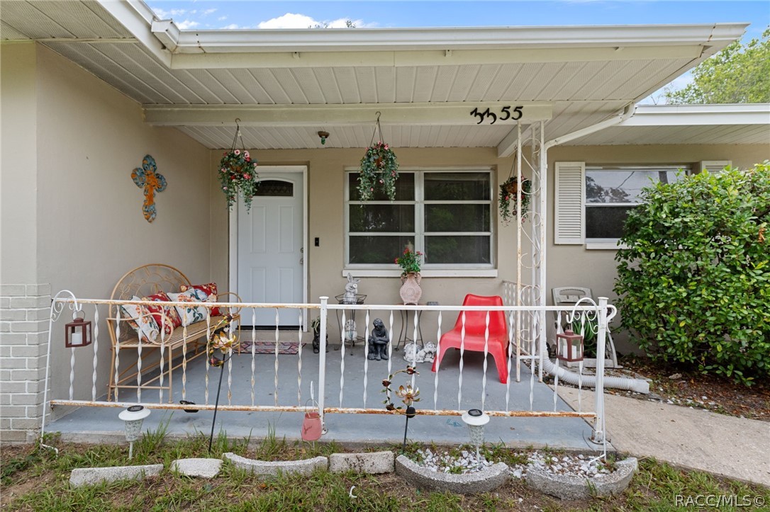 3355 South Highlands Avenue Inverness, FL 34452 - Photo 3 of 30 a view of a chairs and tables in patio