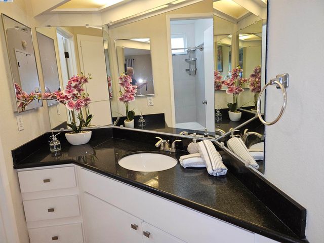 a bathroom with sink and mirror