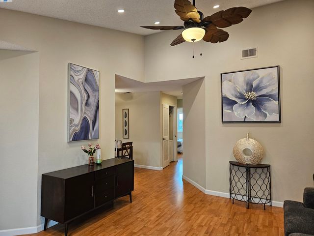 a view of room with wooden floor