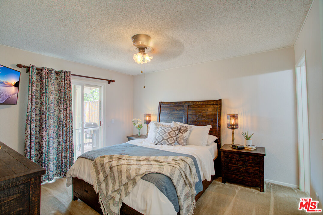 6397 Pine Falls Trail Riverside, CA 92509 - Photo 8 of 14 a bedroom with a bed and a window