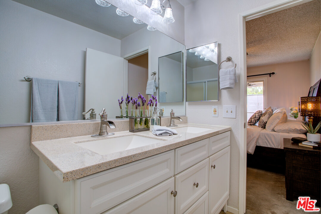 6397 Pine Falls Trail Riverside, CA 92509 - Photo 9 of 14 a bathroom with a sink and a mirror