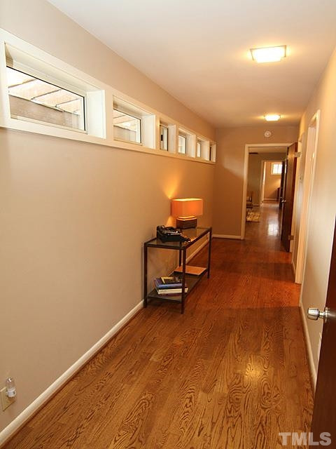 4901 Rembert Drive Raleigh, NC 27612 - Photo 4 of 25 Hallway to hall bathroom, two main level bedrooms, a sitting room and a master suite. Hallway