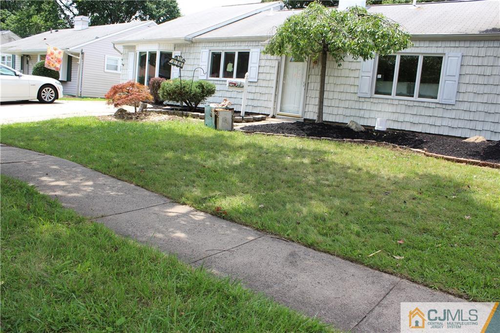 14 Kenmore Road Edison, NJ 08817 - Photo 19 of 21 a front view of house with yard and green space