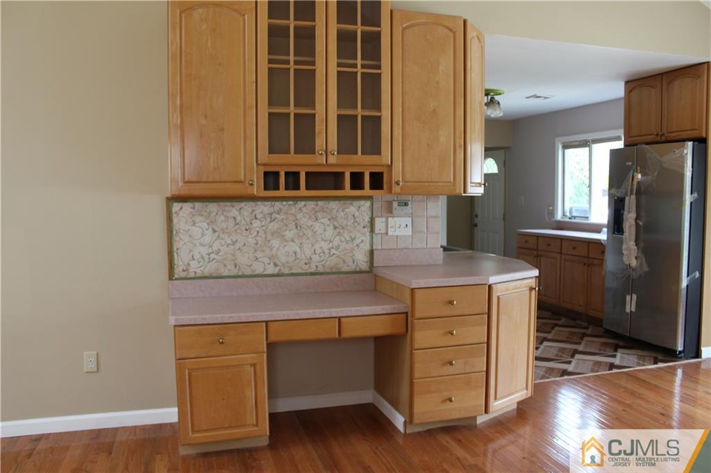 14 Kenmore Road Edison, NJ 08817 - Photo 4 of 21 a kitchen with a wooden floor and a cabinets
