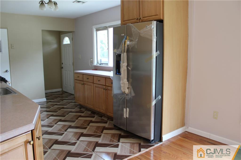 14 Kenmore Road Edison, NJ 08817 - Photo 5 of 21 a bathroom with a sink and a mirror