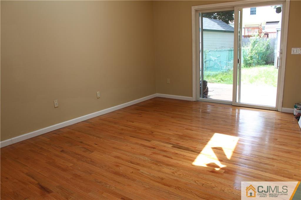 14 Kenmore Road Edison, NJ 08817 - Photo 9 of 21 a view of an empty room and wooden floor and a window