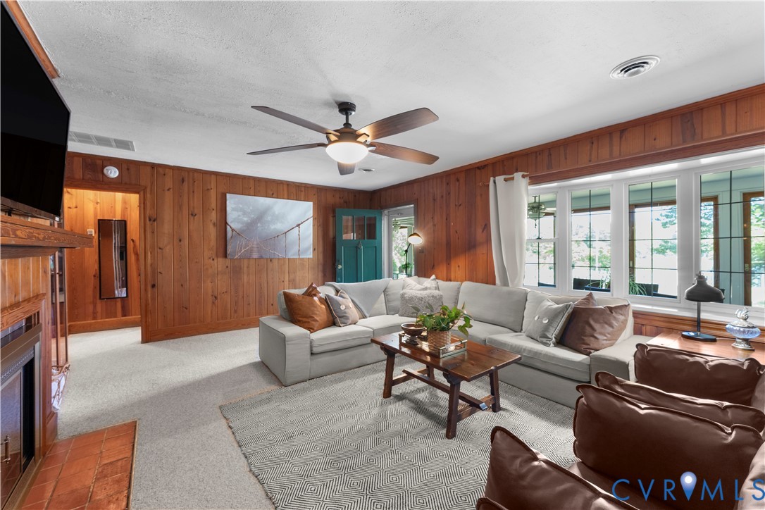 437 Plainview Road Kinsale, VA 22488 - Photo 33 of 63 a living room with furniture and a flat screen tv
