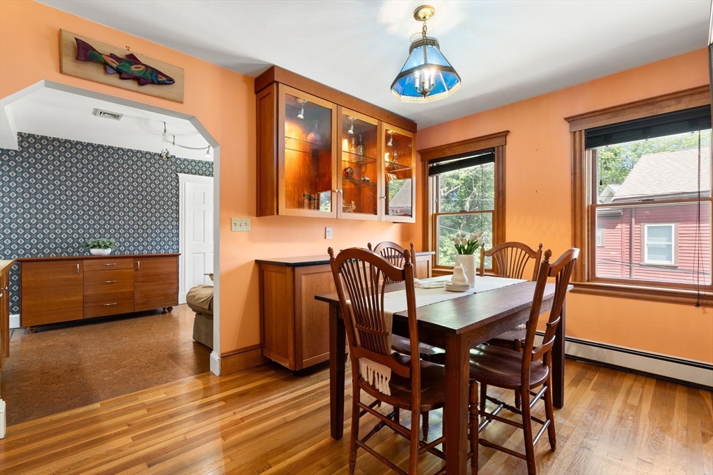 52 Lewis Avenue Arlington, MA 02474 - Photo 12 of 40 a view of a dining room with furniture window and wooden floor