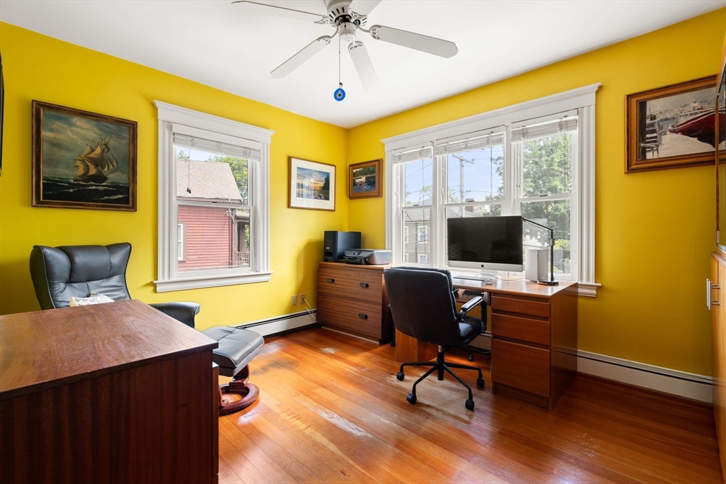 52 Lewis Avenue Arlington, MA 02474 - Photo 13 of 40 a view of a livingroom with workspace and a window