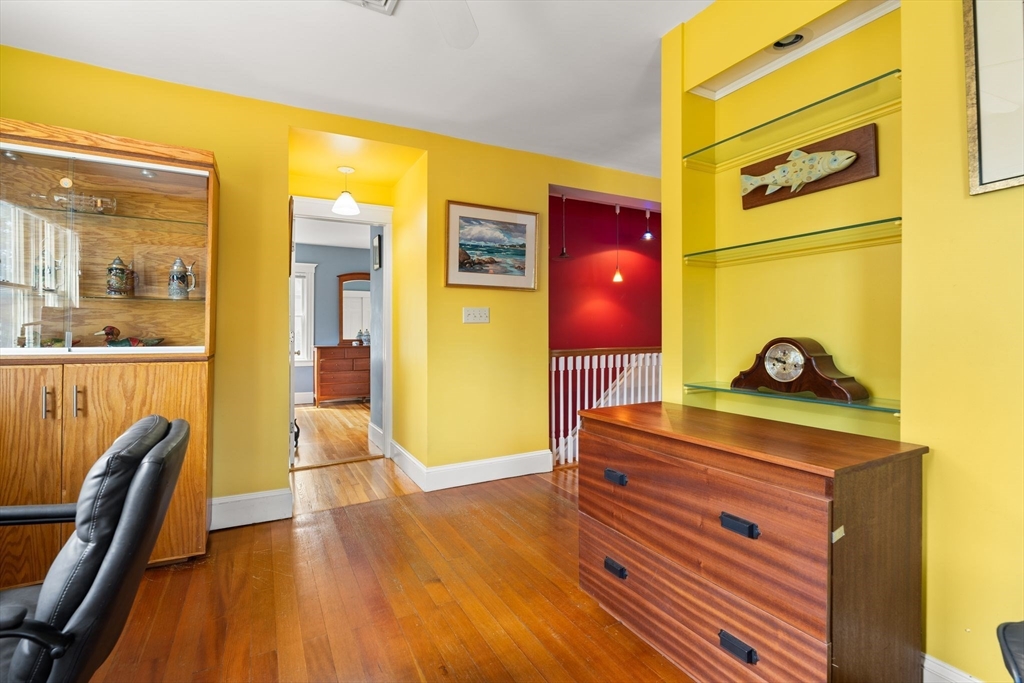 52 Lewis Avenue Arlington, MA 02474 - Photo 14 of 40 a bedroom with a bed and wooden floor