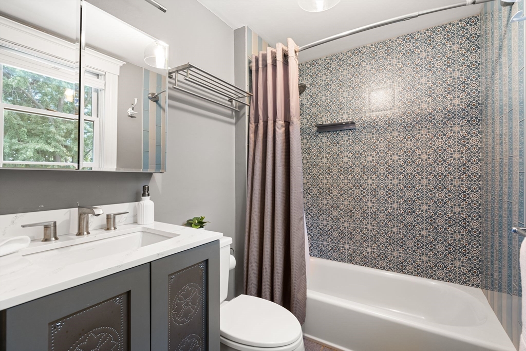 52 Lewis Avenue Arlington, MA 02474 - Photo 15 of 40 a bathroom with a sink toilet and shower