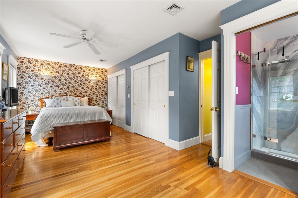 52 Lewis Avenue Arlington, MA 02474 - Photo 17 of 40 a bedroom with a bed and wooden floor