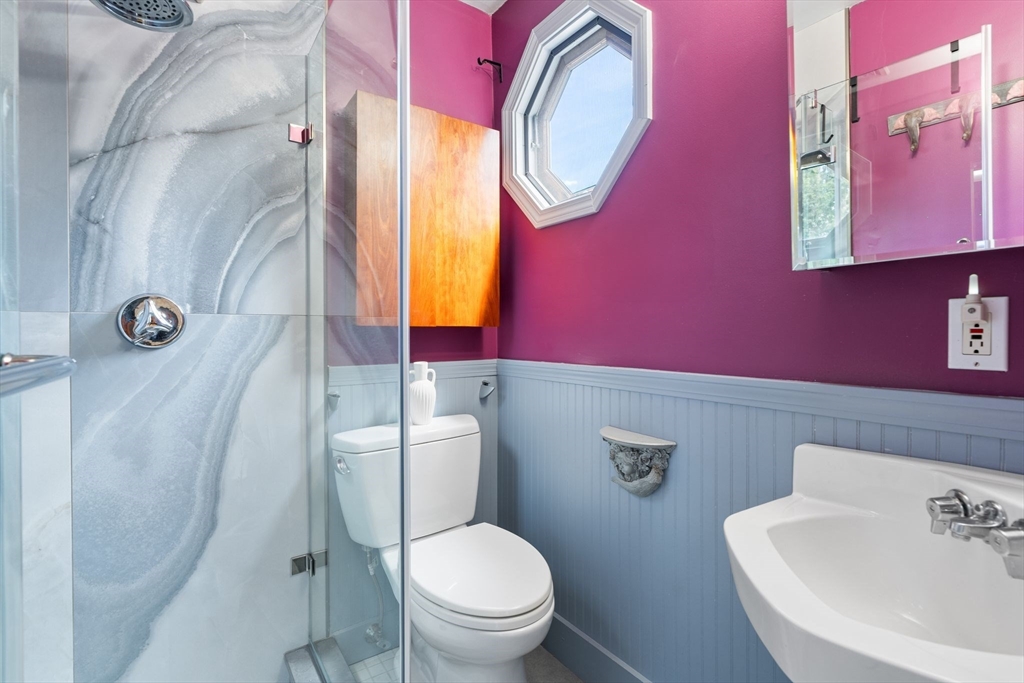 52 Lewis Avenue Arlington, MA 02474 - Photo 20 of 40 a white toilet sitting next to a bathroom sink