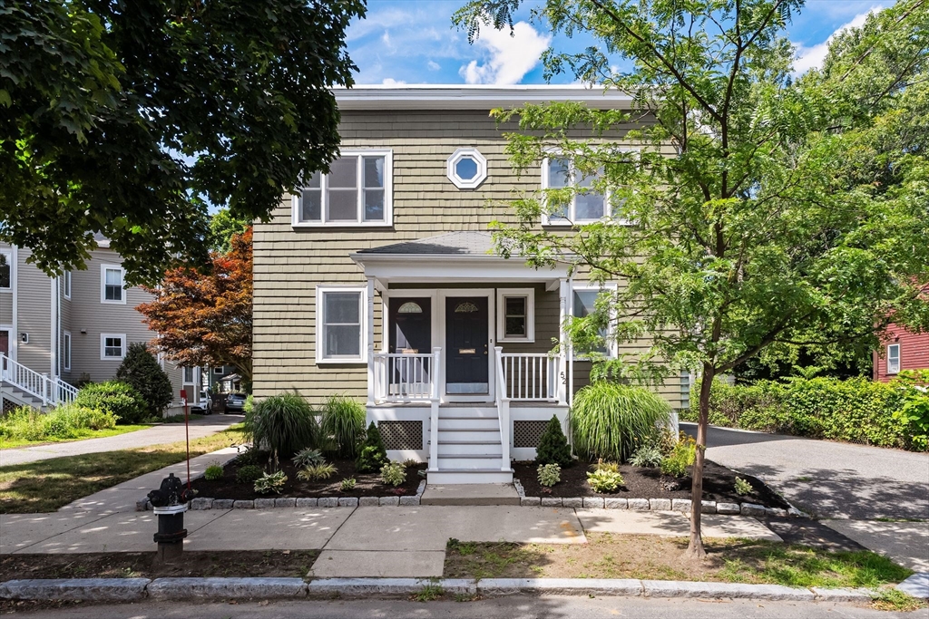 52 Lewis Avenue Arlington, MA 02474 - Photo 2 of 40 a front view of a house with a yard