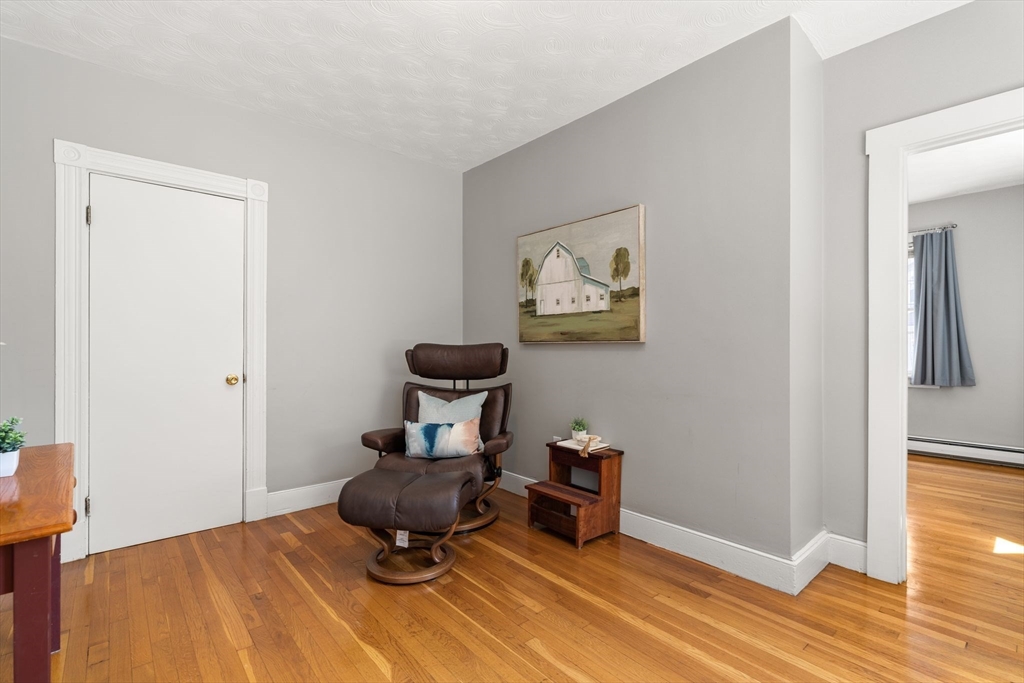 52 Lewis Avenue Arlington, MA 02474 - Photo 24 of 40 a room with furniture and wooden floor