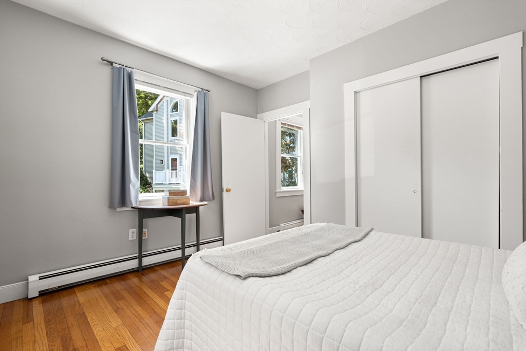 52 Lewis Avenue Arlington, MA 02474 - Photo 29 of 40 a bedroom with a bed and a table