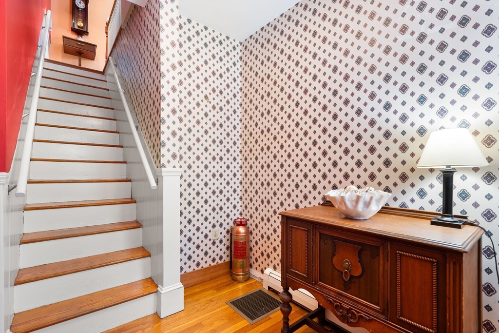 52 Lewis Avenue Arlington, MA 02474 - Photo 4 of 40 a view of a room with furniture and wooden floor