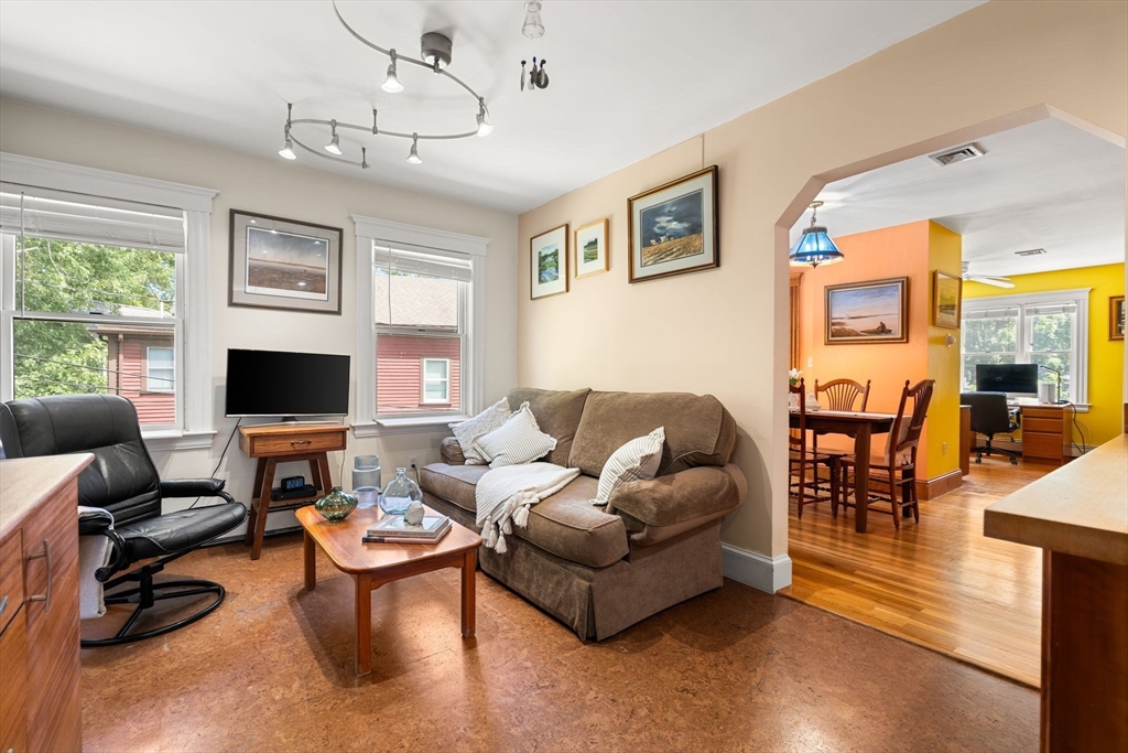 52 Lewis Avenue Arlington, MA 02474 - Photo 5 of 40 a living room with furniture kitchen view and a large window